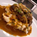 Salisbury Steak with Garlic Mashed Potatoes and Mushroom & Onion Gravy